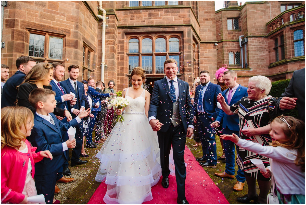 Cheshire Wedding-10028 confetti bride and groom with family cheshire wedding