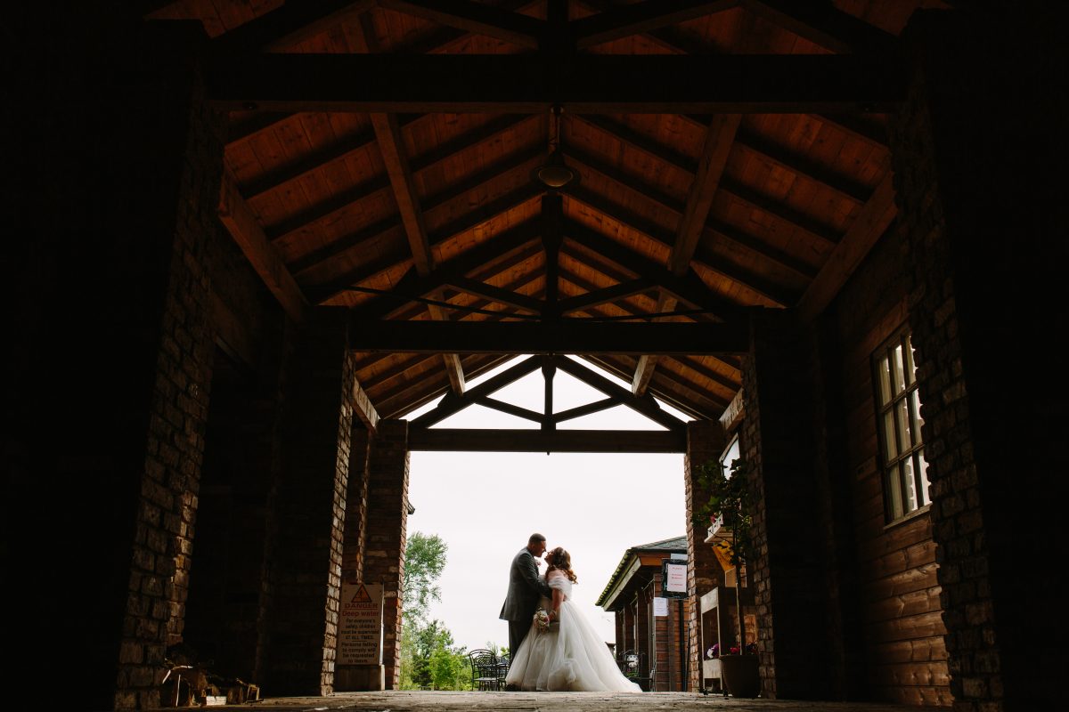 Charnock Farm wedding lancashire photography bride and groom kissing in charnock farm lancashire photography venue