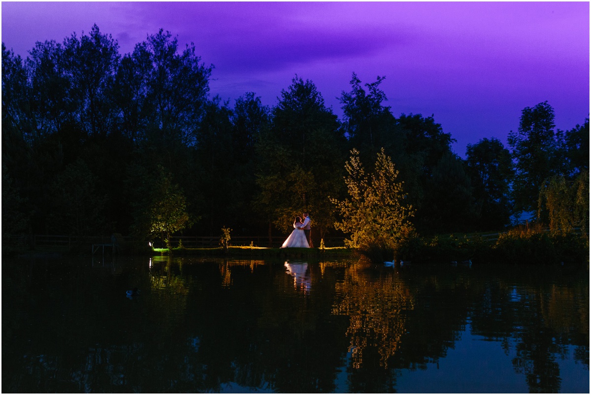 charnock farm wedding bride and groom next to the lake Lancashire wedding photography wedding by kyle
