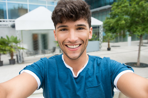 Young man takes a selfie